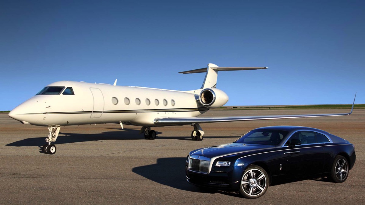 Private jet and luxury vehicle